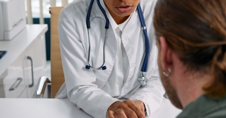 Doctor consulting a patient about medical cover, illustrating a Gap Cover comparison in South Africa