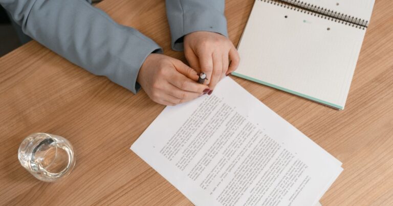 Hands reviewing a medical account and claim paperwork on a desk before submitting a Gap Cover claim in South Africa